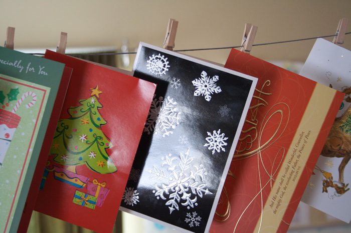 christmas cards hanging on a line